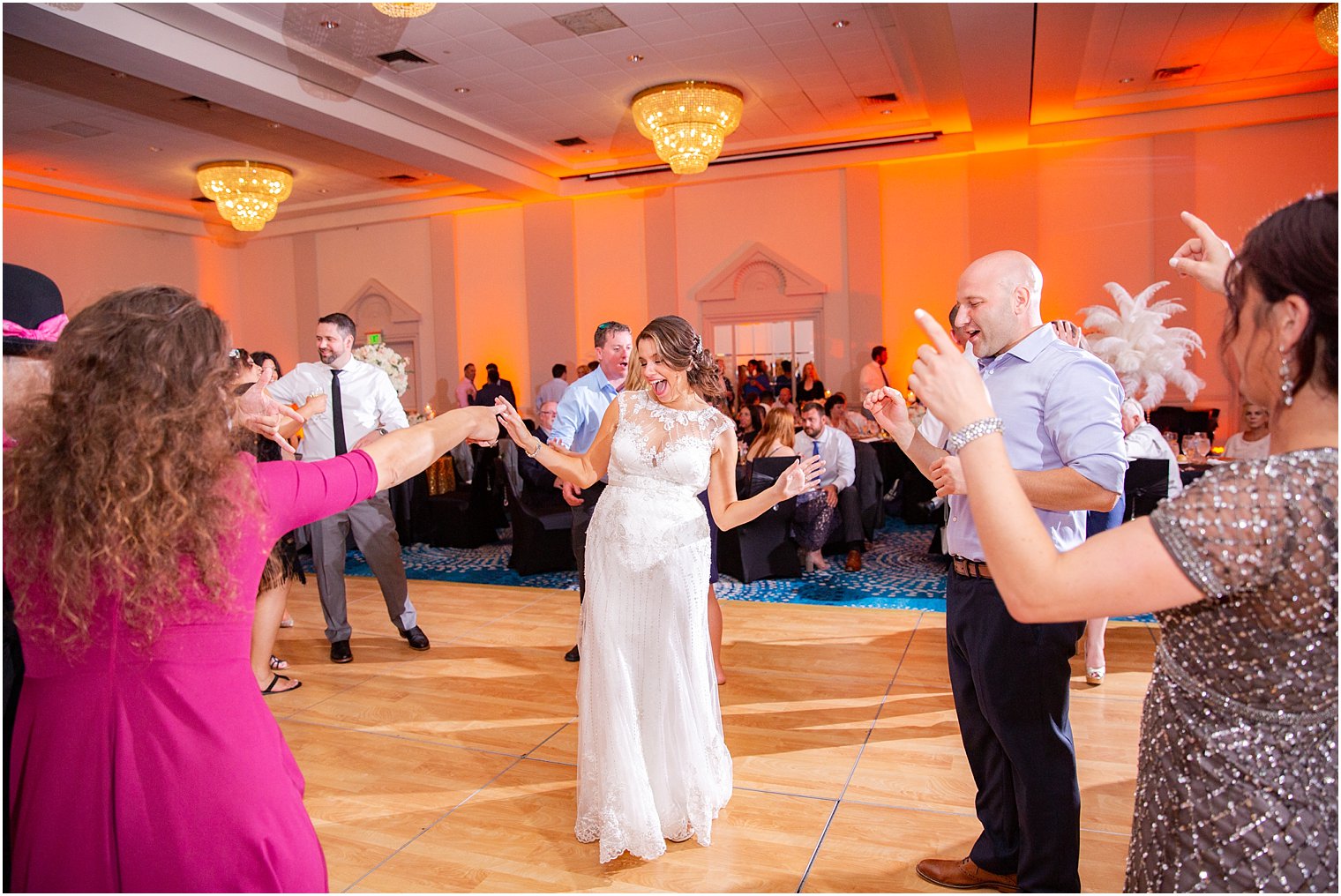 bride laughing with wedding guests at Ocean Place Resort and Spa