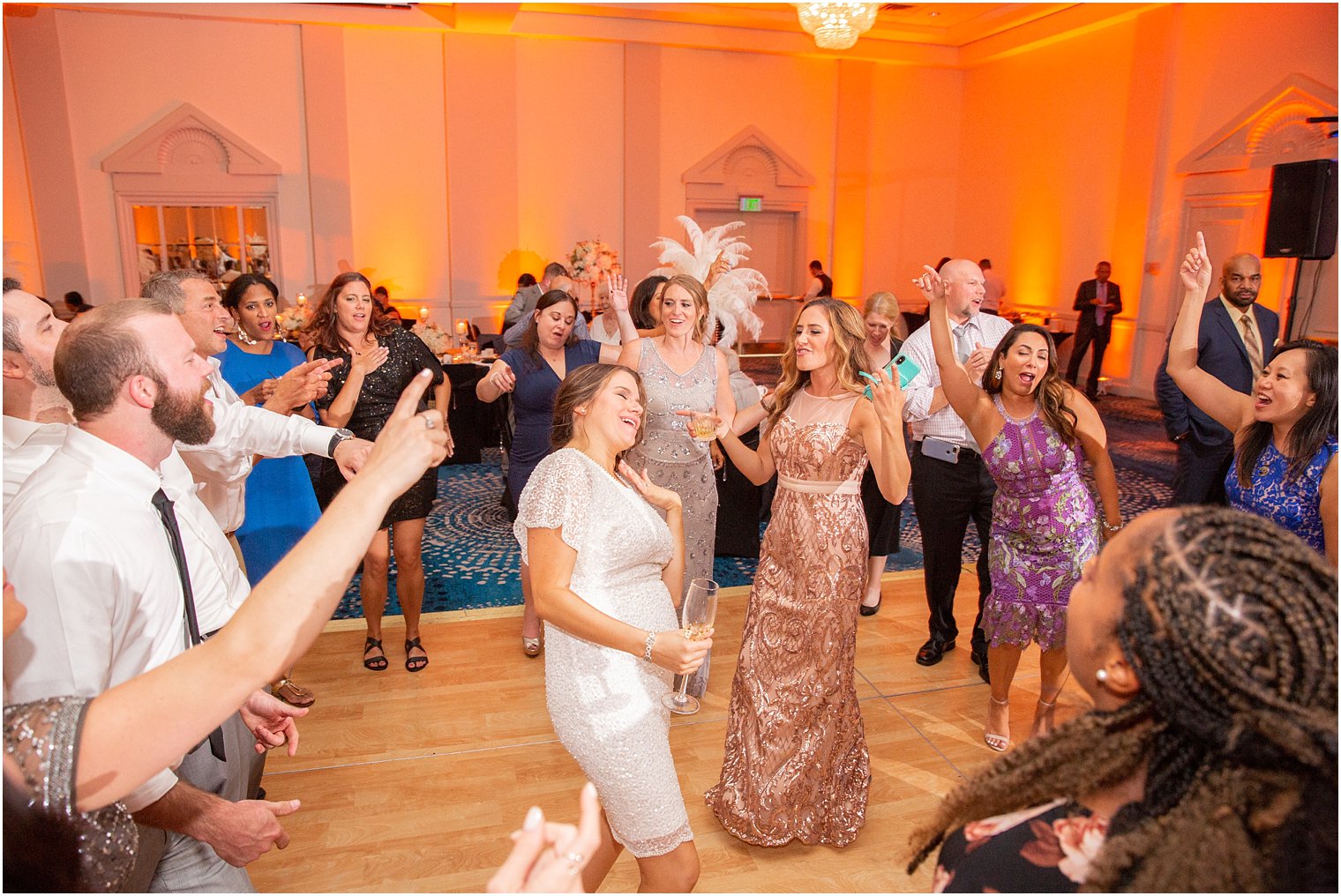 bride dances with bridesmaid at wedding reception at Ocean Place Resort