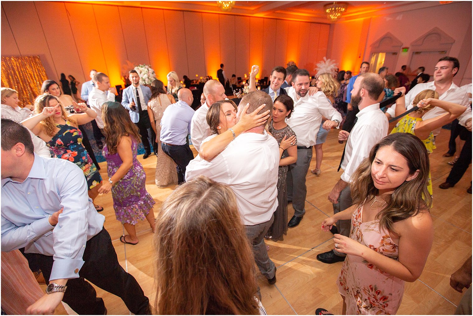 bride and groom kiss during wedding reception dancing photographed by Idalia Photography