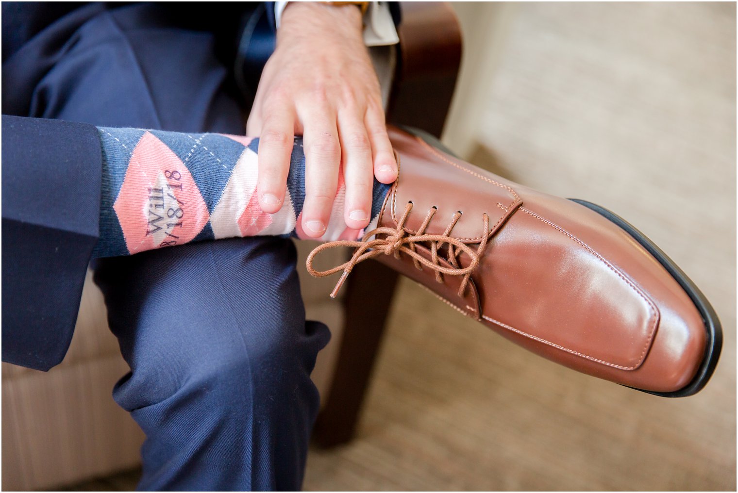 Groom with custom navy and coral socks