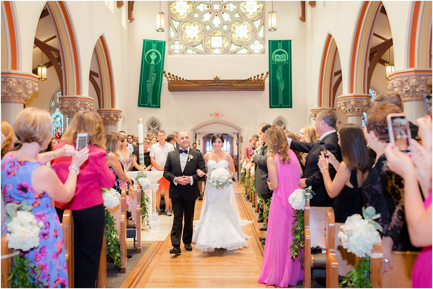 proud father walks daughter down the aisle during NJ wedding day photographed by Idalia Photography
