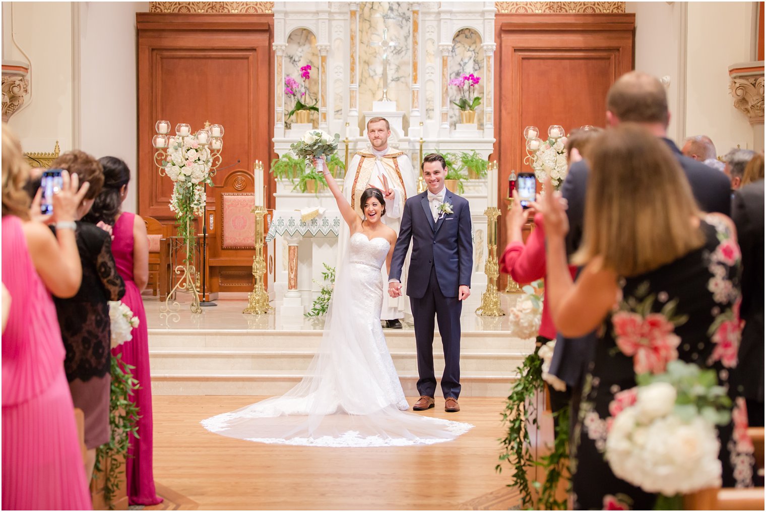 bride and groom celebrate marriage in NJ church photographed by Idalia Photography