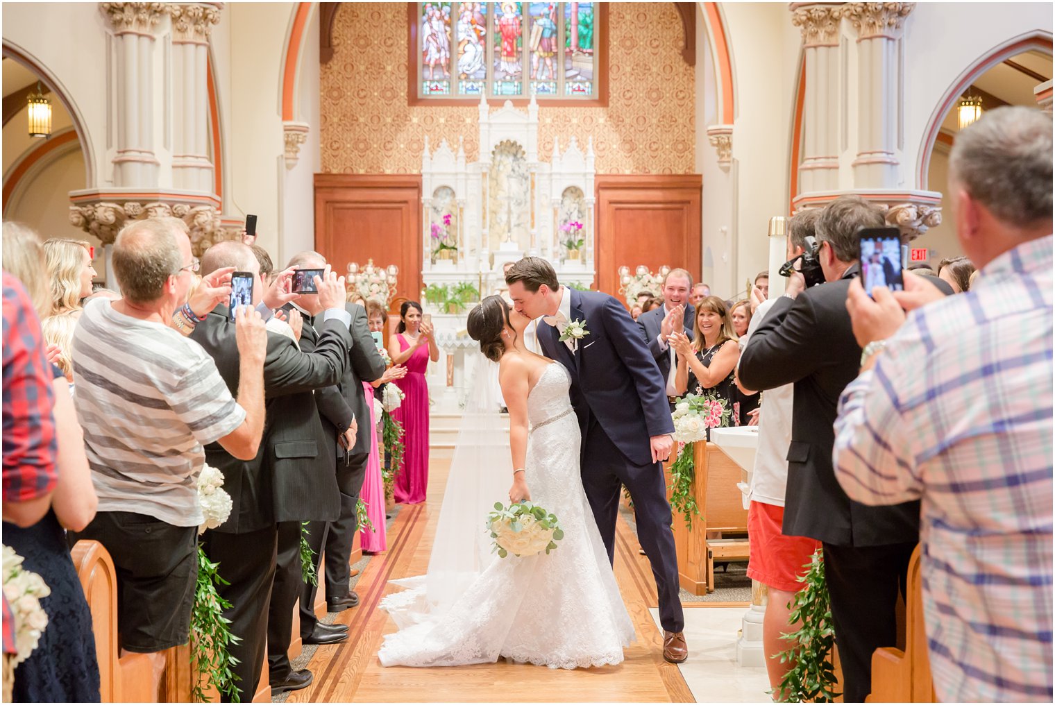 bride and groom recess down the aisle during wedding ceremony photographed by Idalia Photography