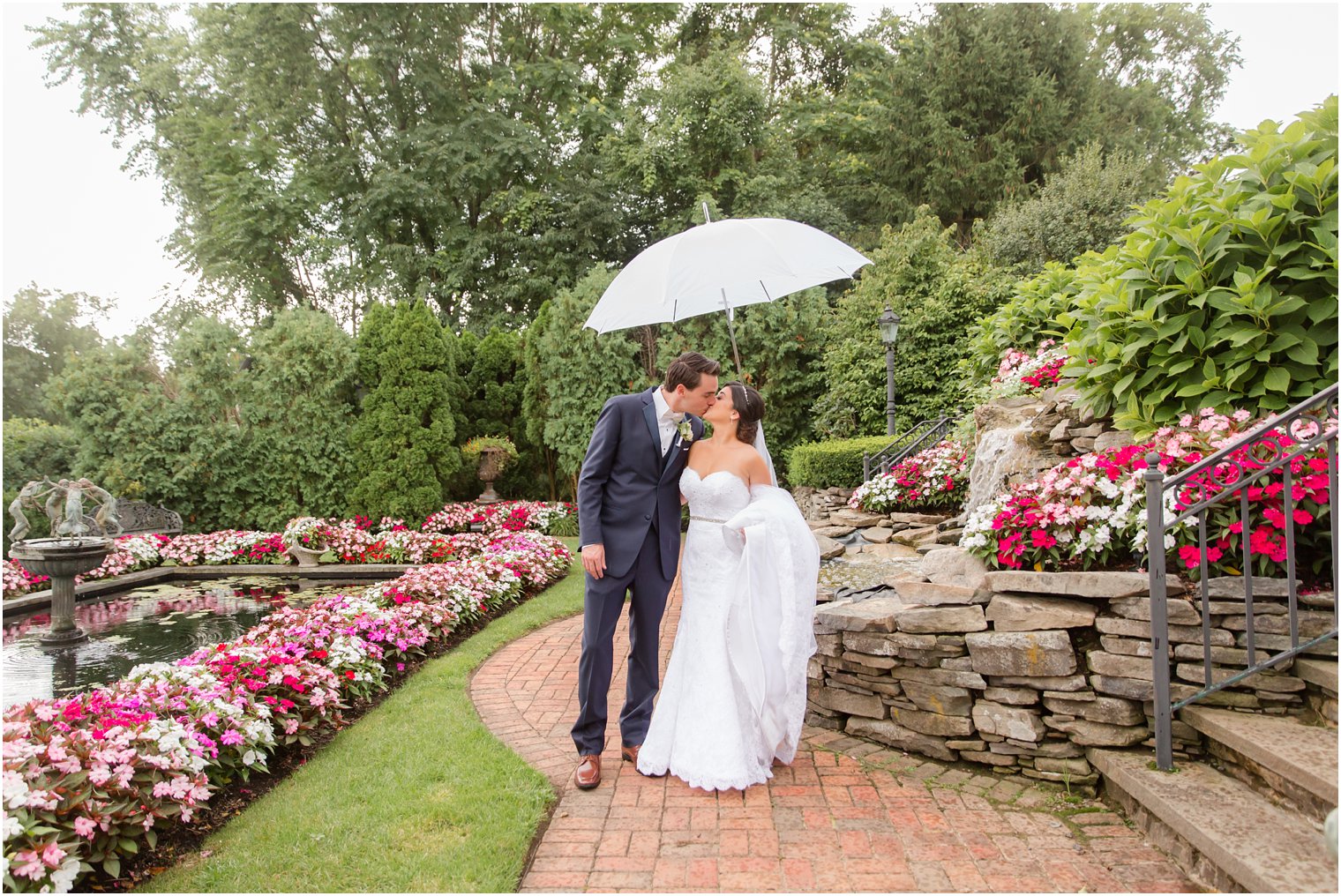 bride and groom pose in gardens on wedding day at Park Savoy Estate 