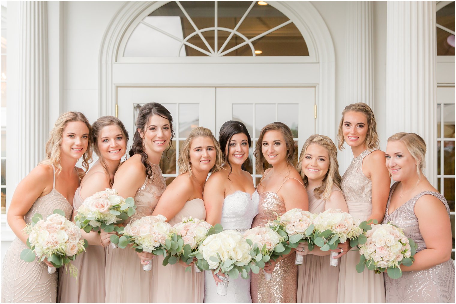 bride with bridesmaids in rose gold gowns at Park Savoy Estate 