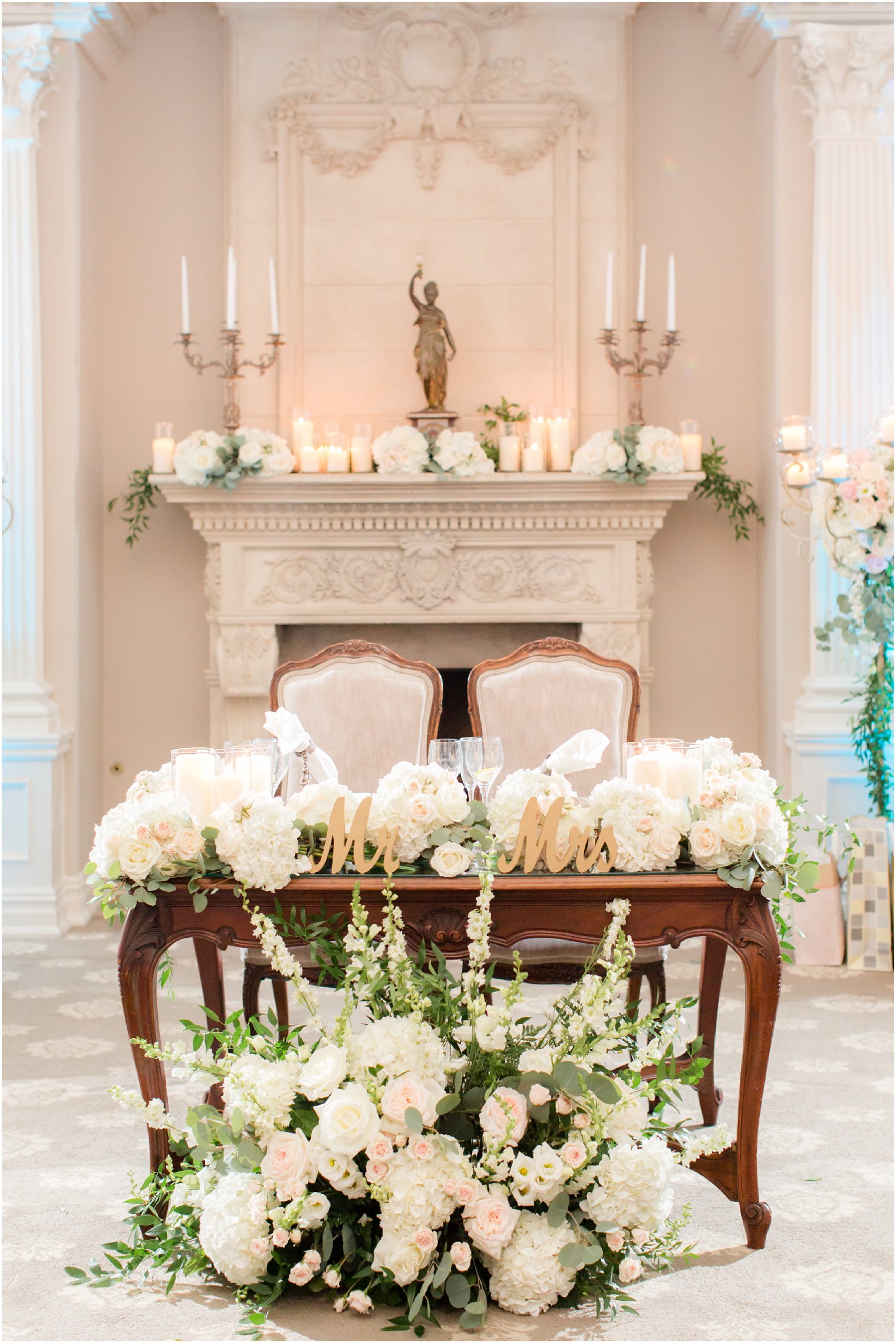 sweetheart table with ivory floral accents by Crest Florist at Park Savoy Estate 