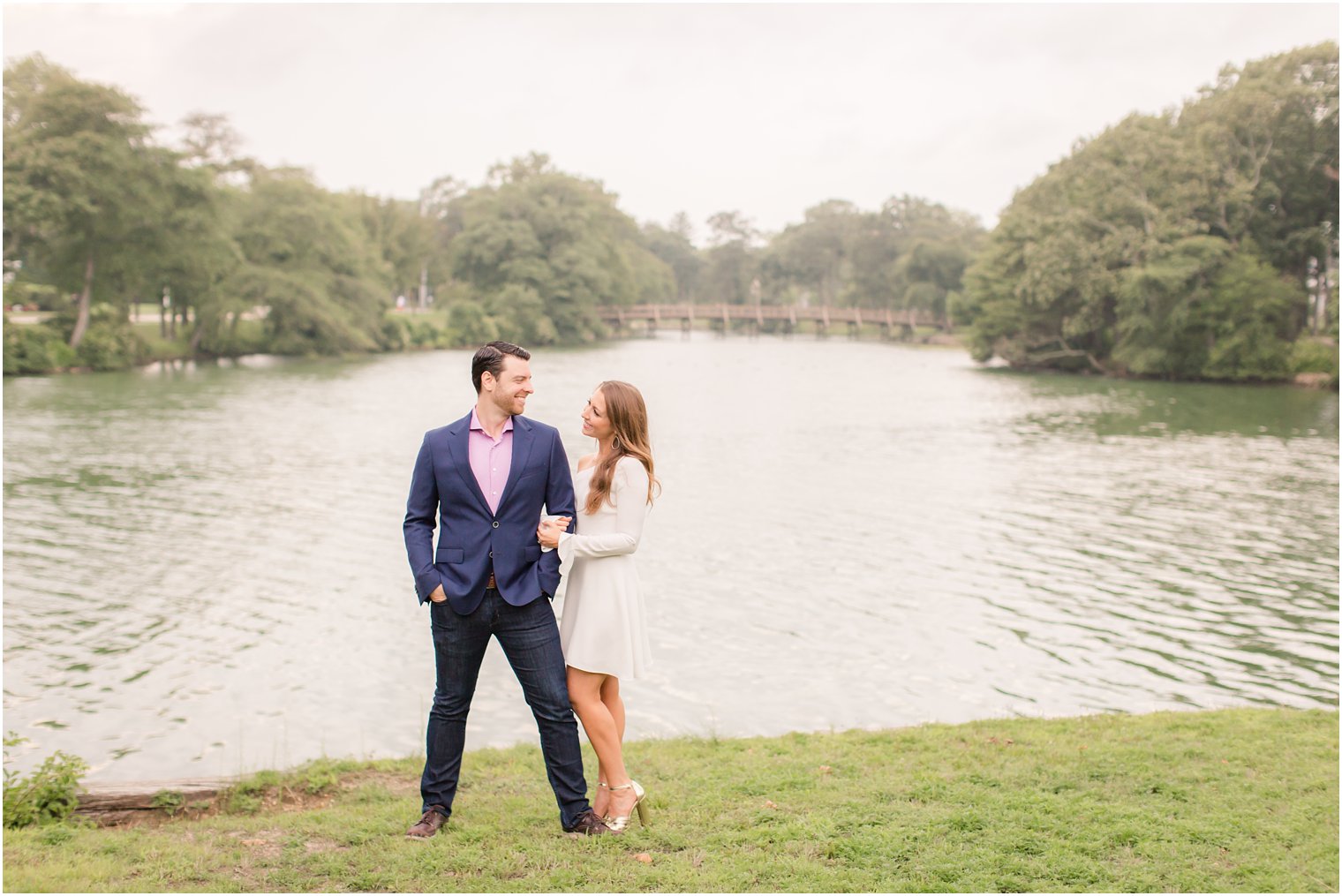 bride and groom to be in front of lake during Spring Lake NJ Engagement session
