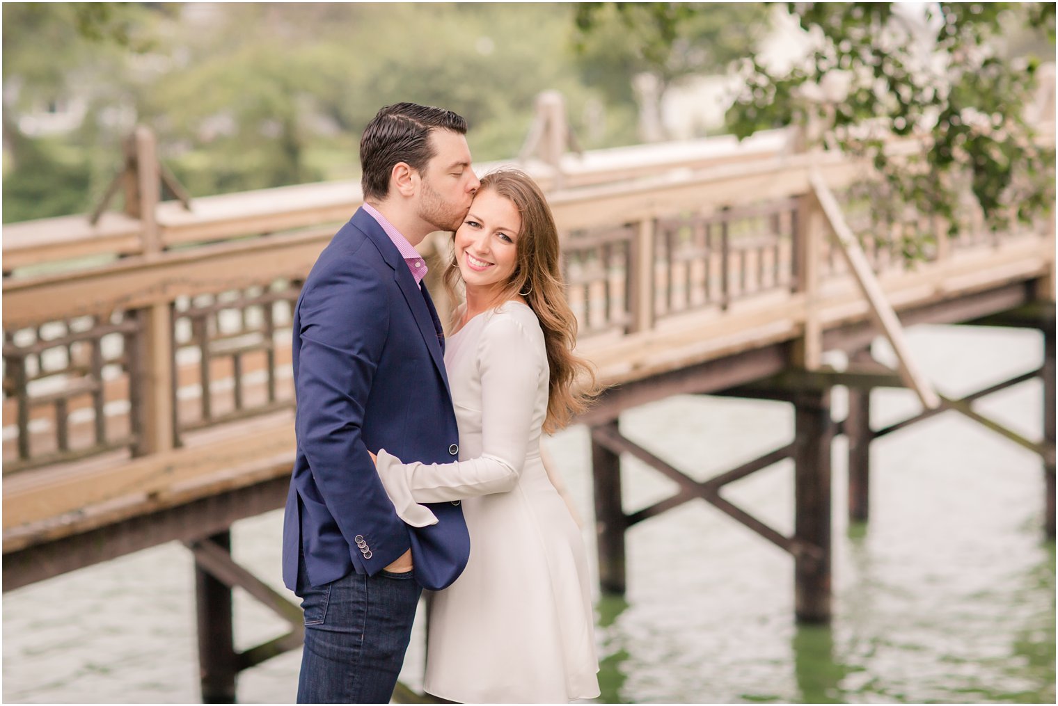 groom kisses bride's forehead during Spring Lake NJ Engagement session