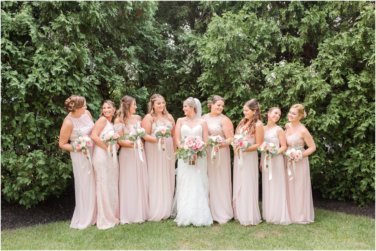 bride in Sottero and Midgley wedding gown with bridesmaids in Adrianna Papell gowns