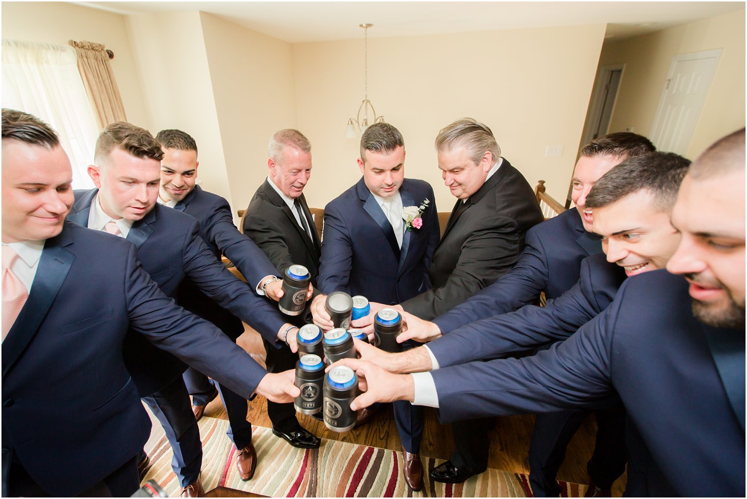 groom and groomsmen cheer wedding day at Palace at Somerset Park