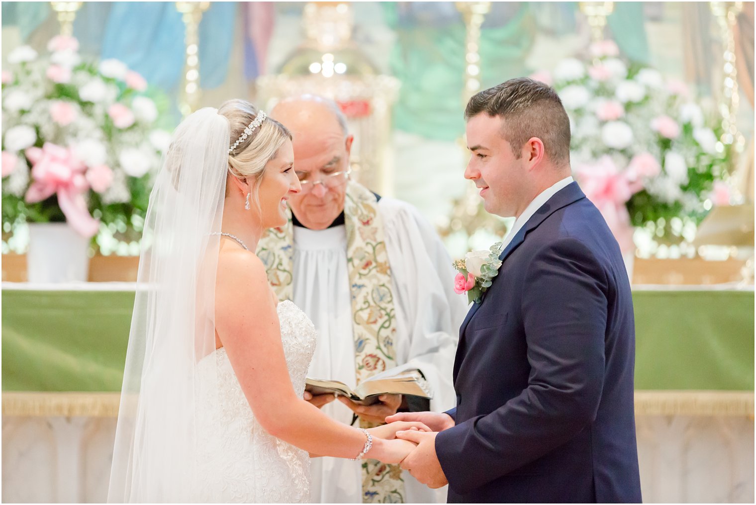 bride and groom hold hands during Somerset NJ wedding ceremony 