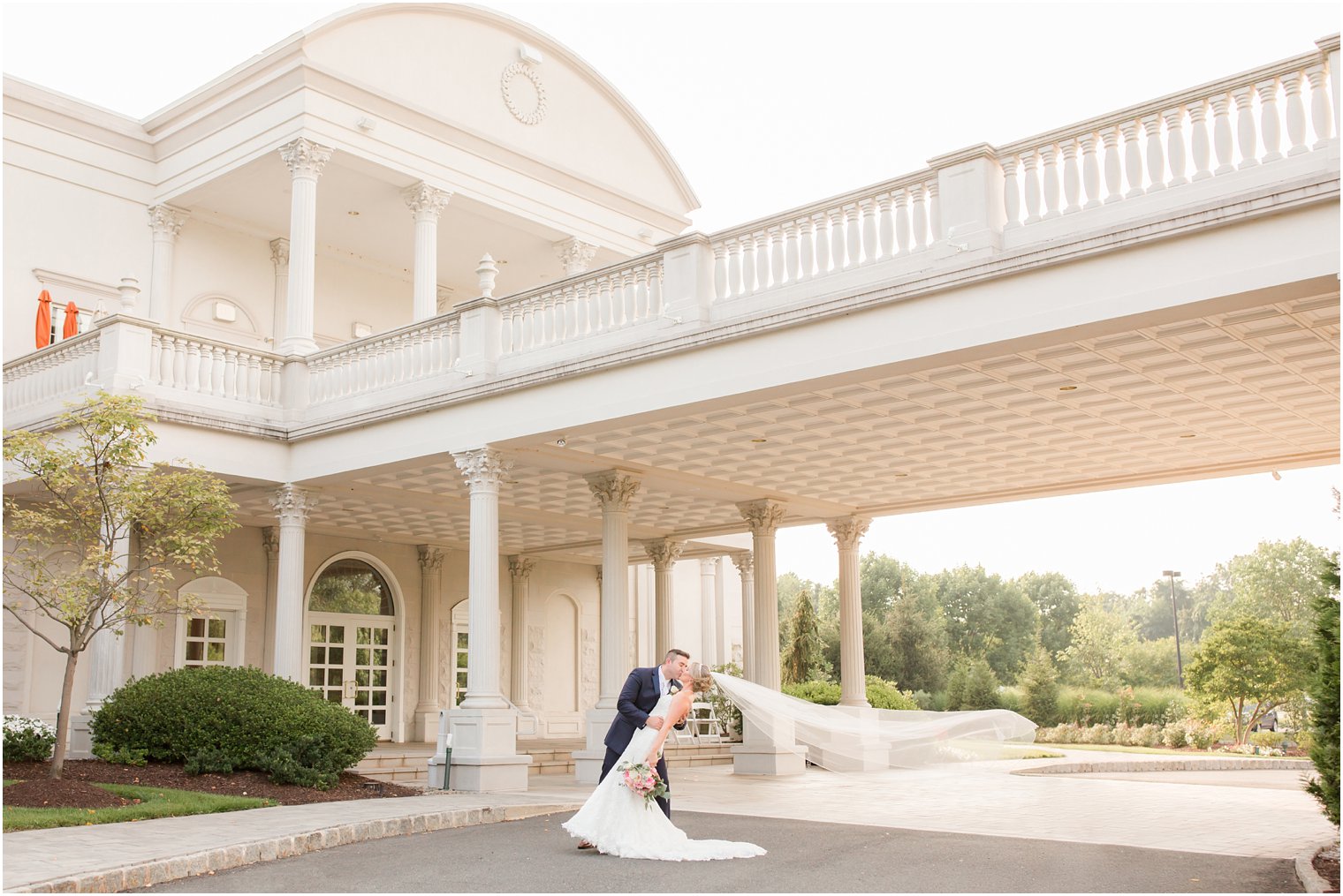 bride and groom kiss on wedding day at Palace at Somerset Park