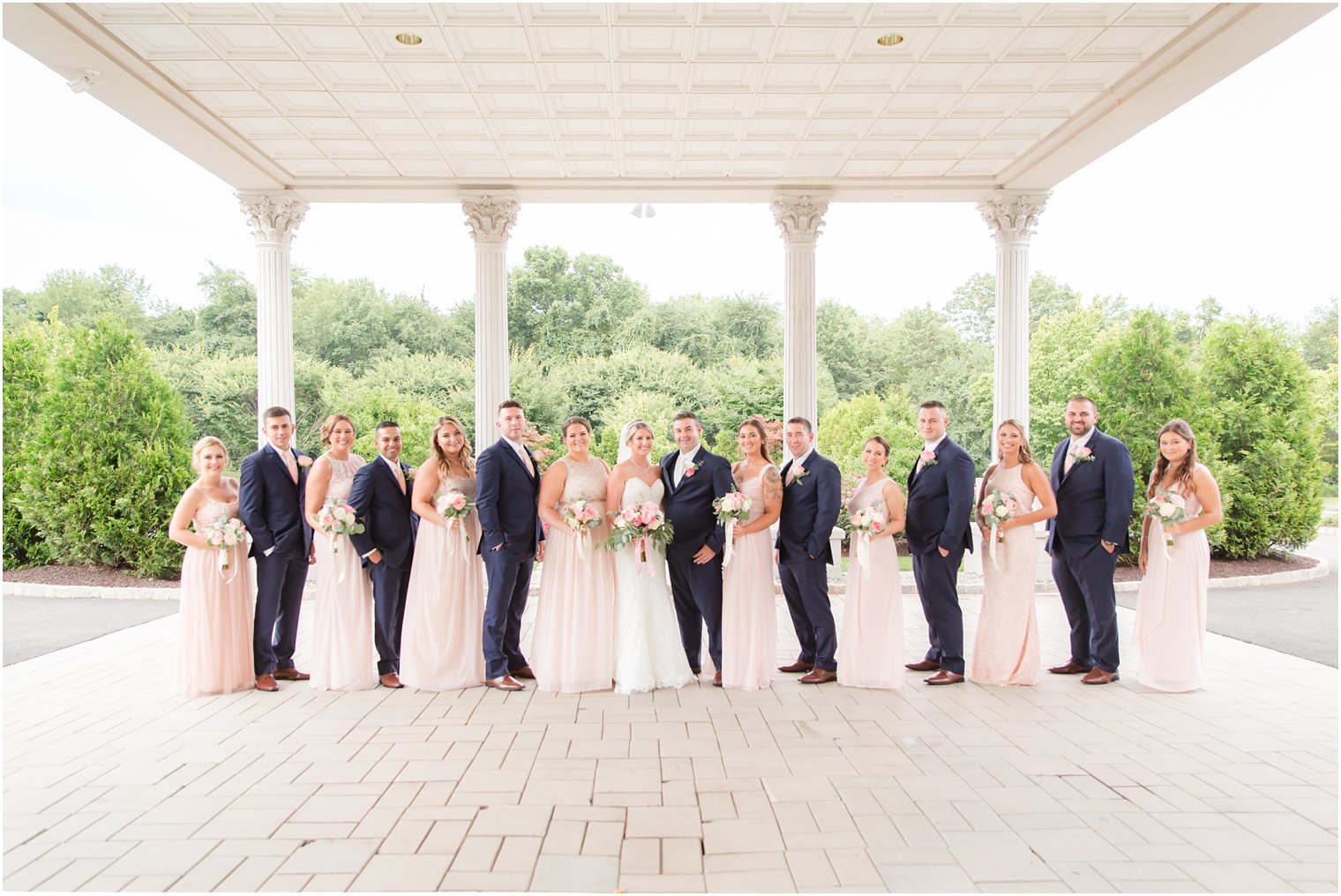 light pink bridesmaid gowns and navy suit at Palace at Somerset Park wedding day