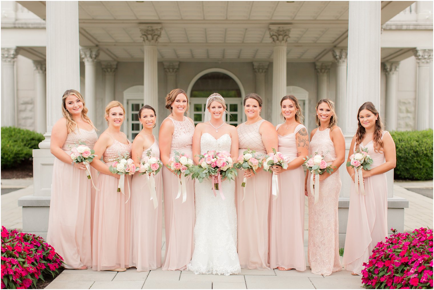 bride with bridesmaids in light pink Adrianna Papell gowns at Palace at Somerset Park