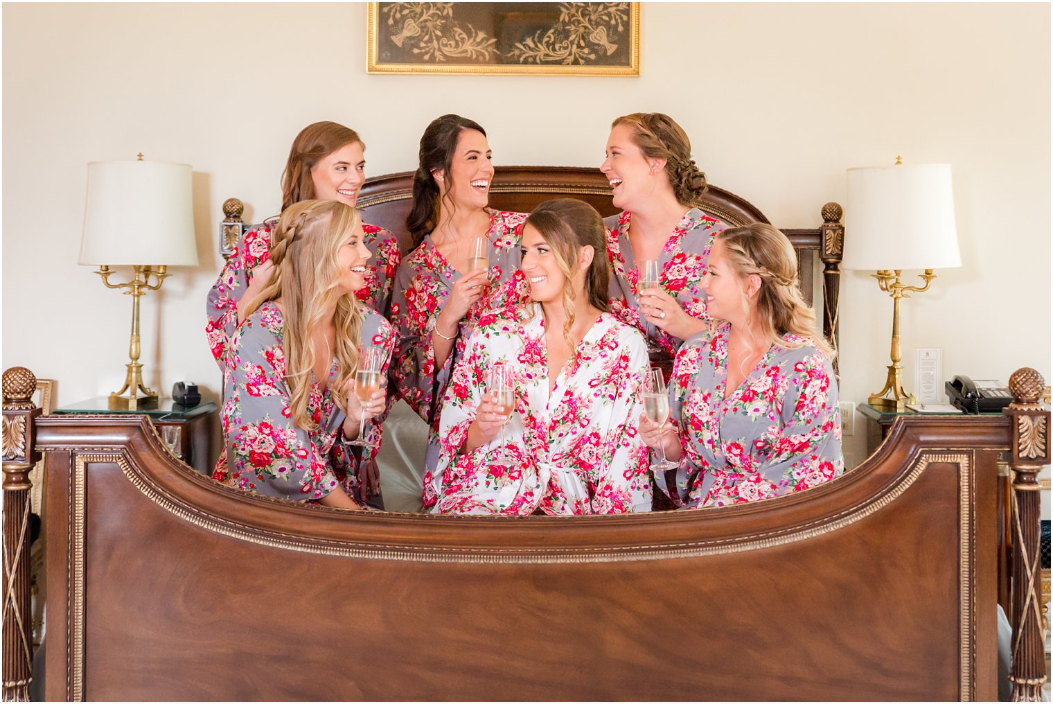 bridesmaids in floral robes with bride getting ready for Jasna Polana wedding