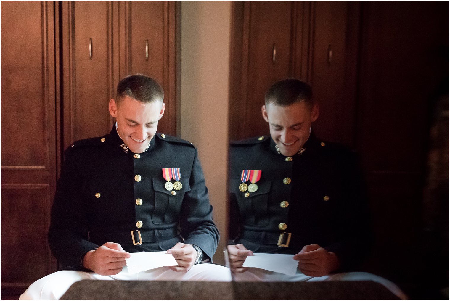 Marine groom reads letter from bride on wedding day photographed by Idalia Photography associate photographer Jocelyn