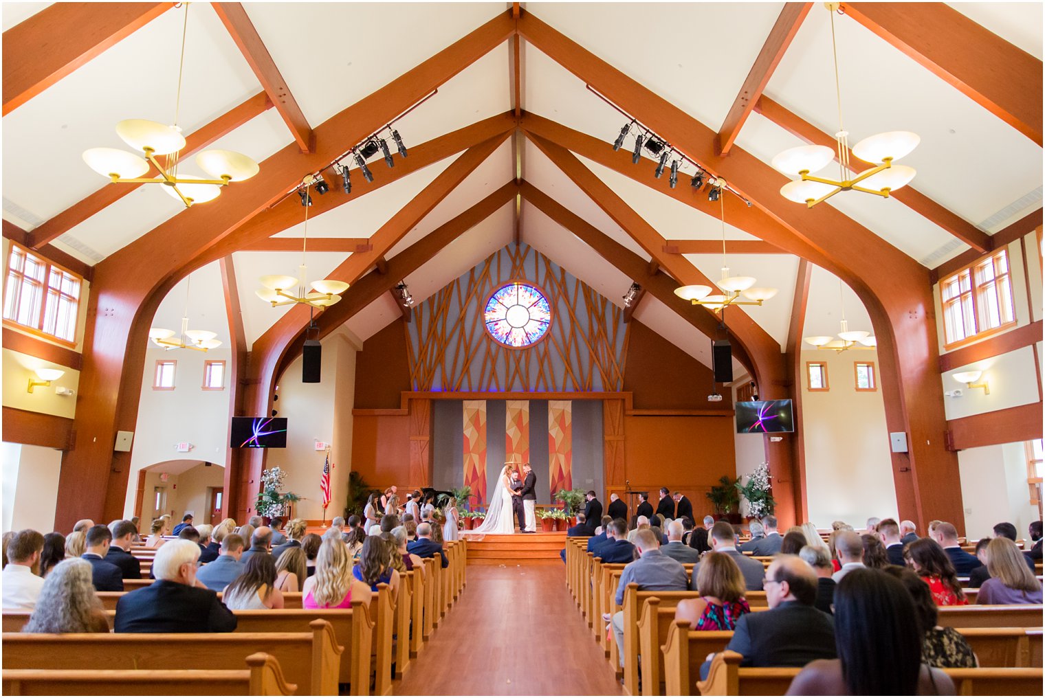 bride and groom exchange vows during NJ wedding ceremony photographed by Idalia Photography associate photographer Jocelyn