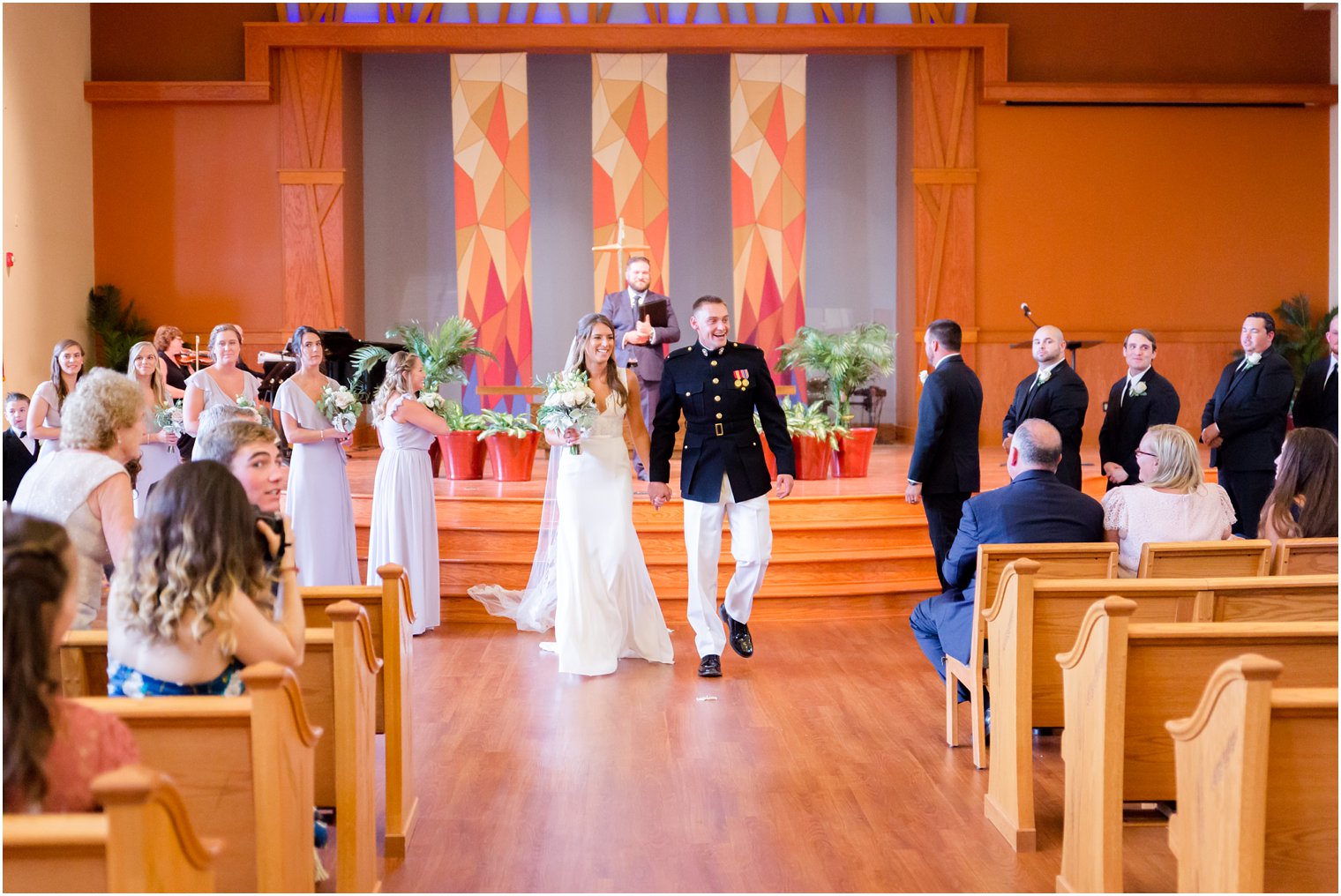 bride and groom walk up aisle after ceremony at Princeton Meadow Chapel