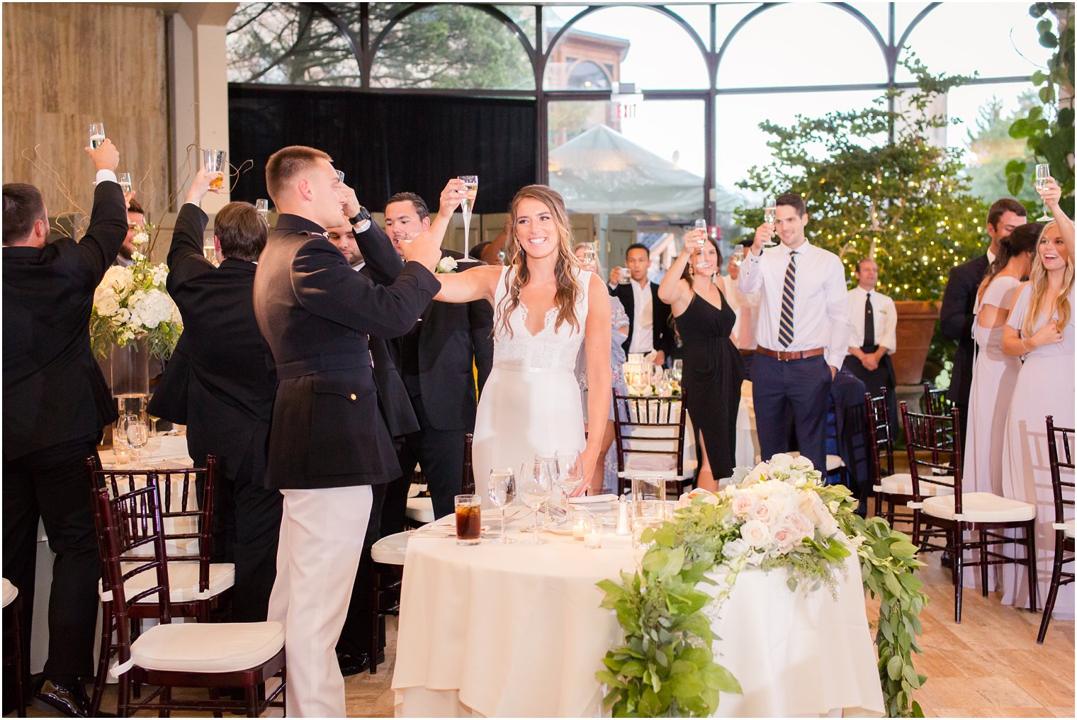 bride and groom toasting during wedding reception at Jasna Polana