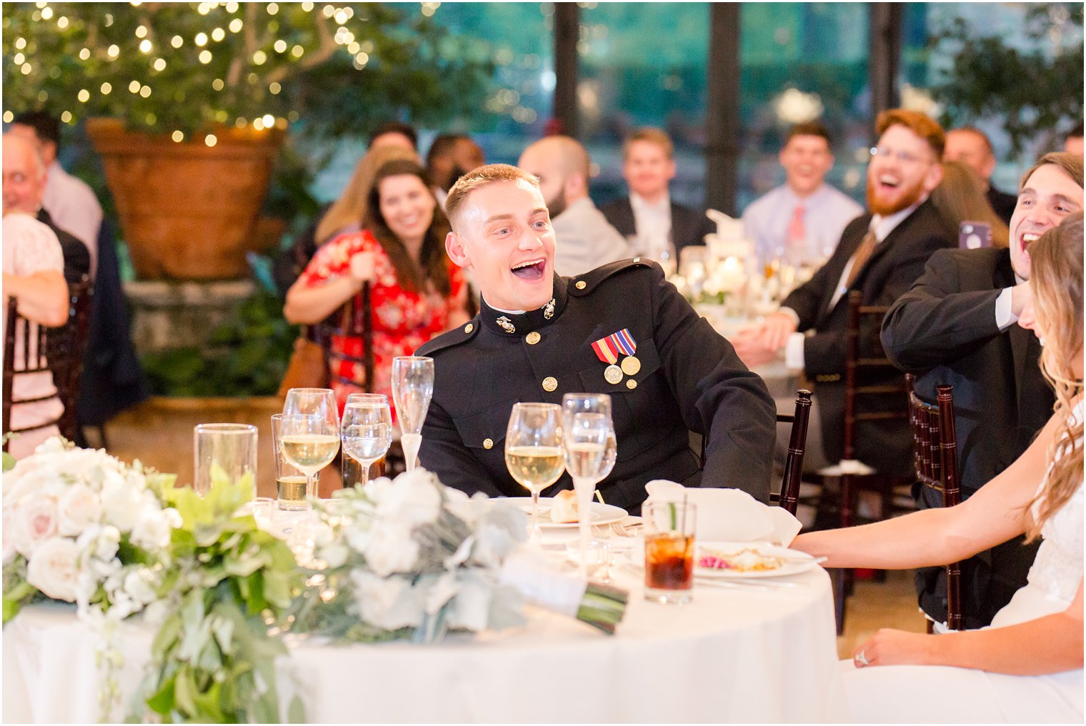 groom laughs at bride during wedding toast at Jasna Polana