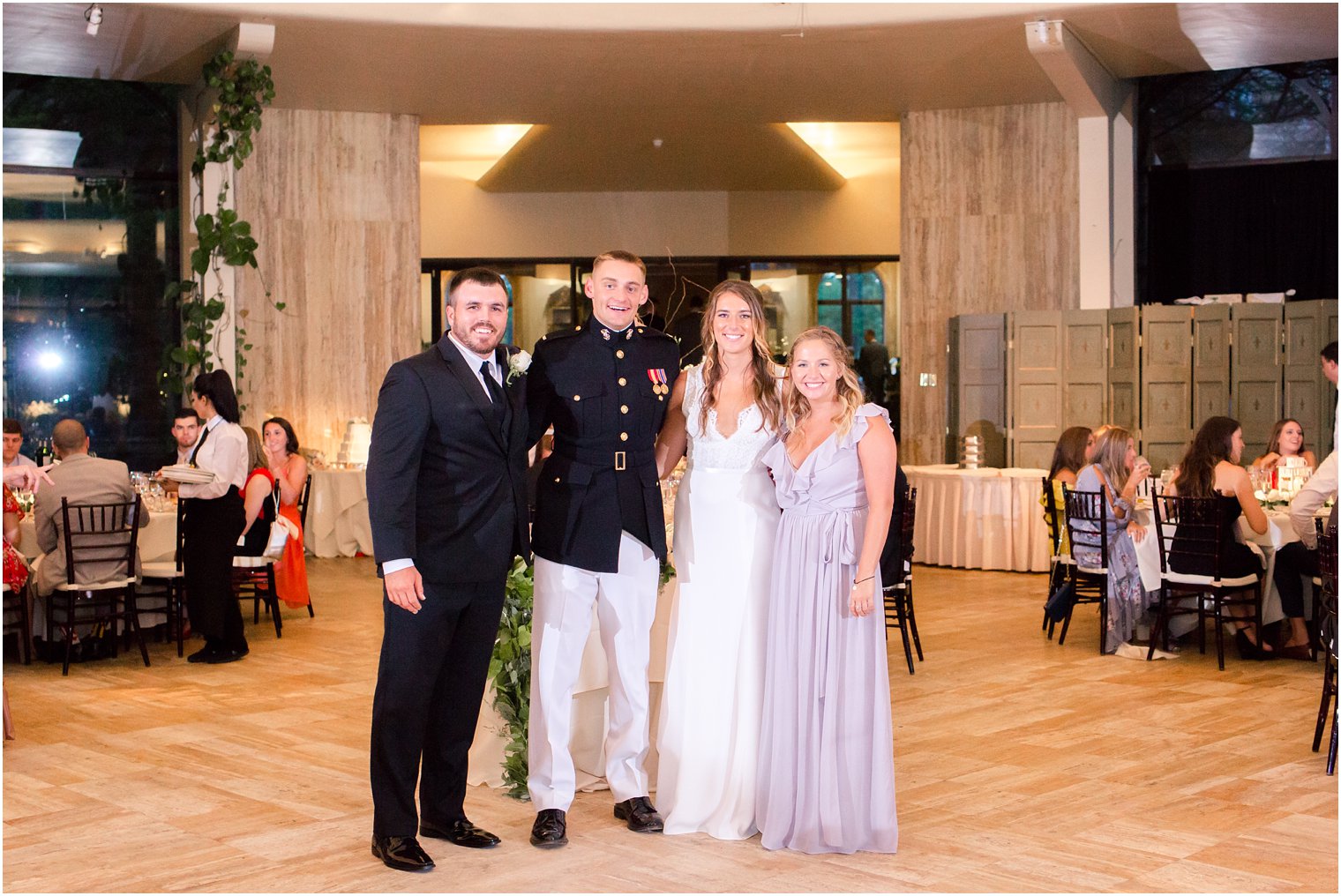 bride and groom with maid of honor and best man at Jasna Polana wedding reception