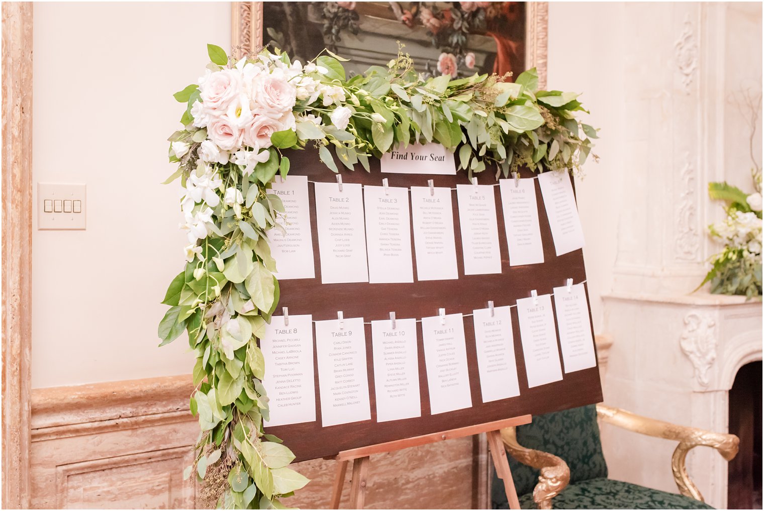 reception seating chart with greenery and pink roses at Jasna Polana