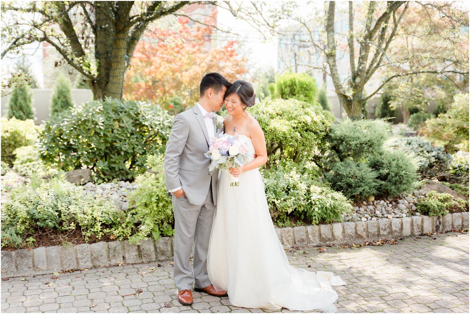 Groom nuzzles new bride at The Bethwood in New Jersey photographed by Idalia Photography