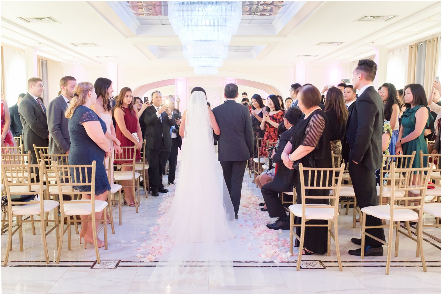 bride walks down the aisle with her father at New Jersey wedding ceremony at The Bethwood