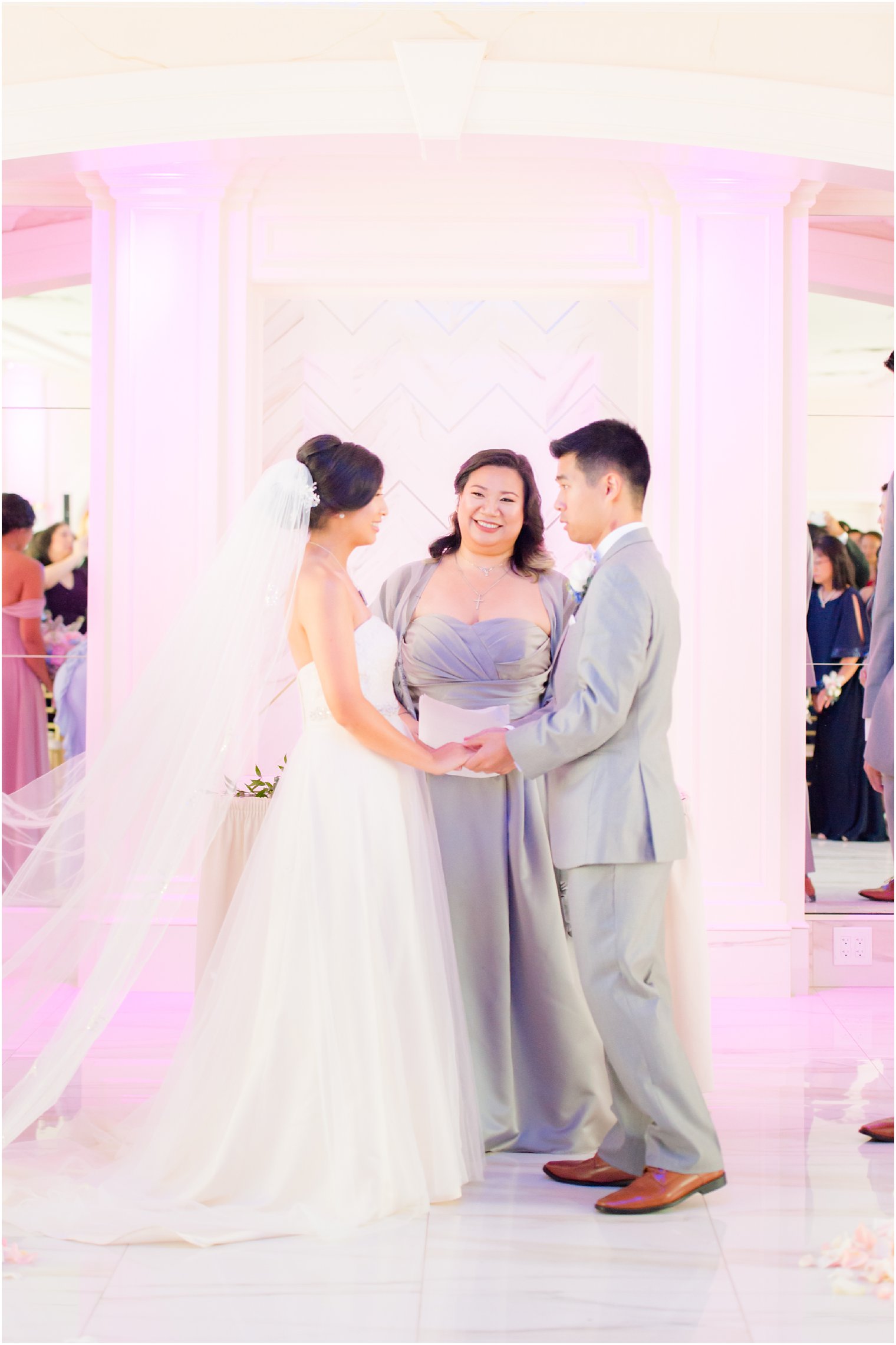 wedding ceremony with pink uplighting at The Bethwood