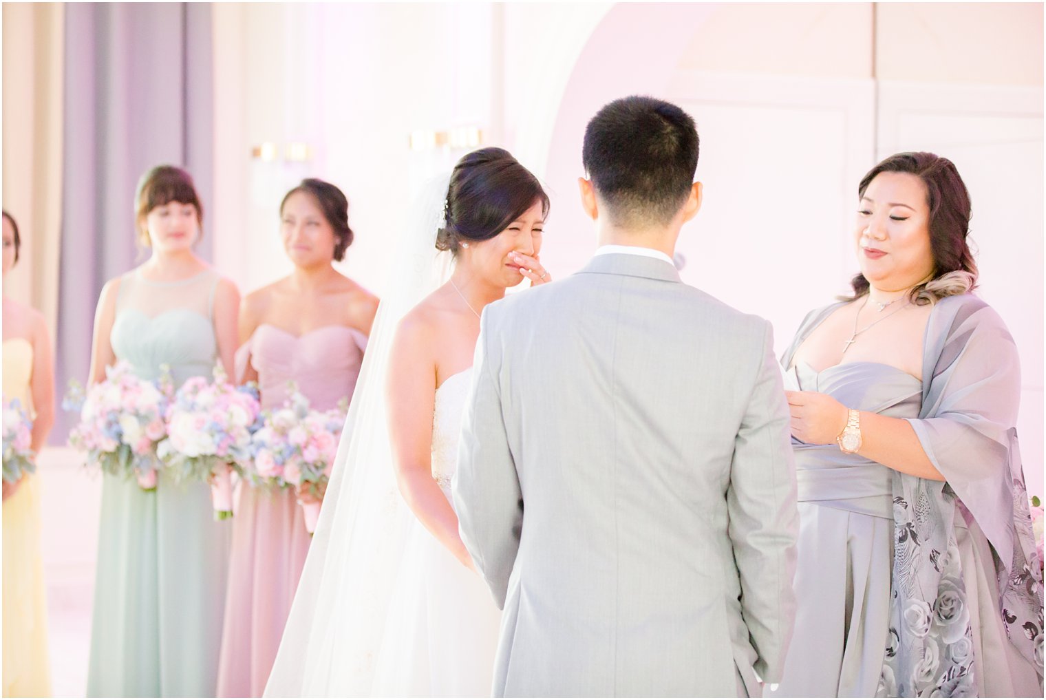 bride cries during wedding vows photographed by Idalia Photography associate photographer Jocelyn