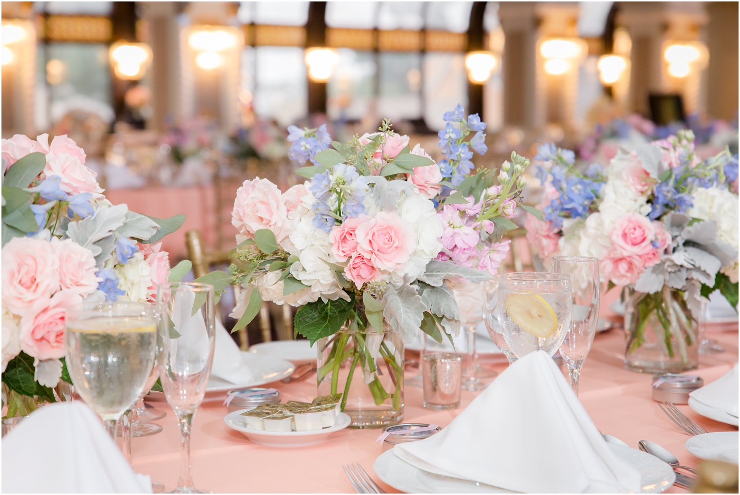 pink, purple, and ivory flower centerpieces by Secret Garden at The Bethwood