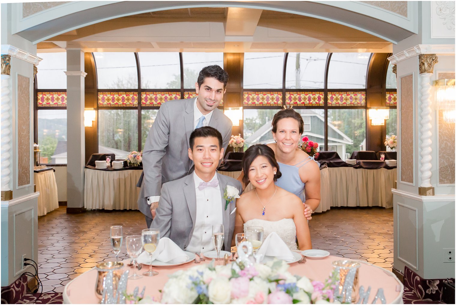 maid of honor and best man with bride and groom during reception at The Bethwood