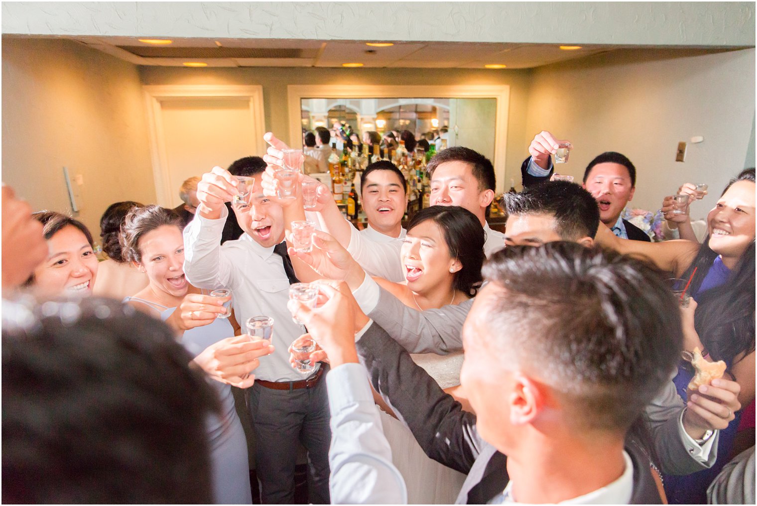 bride and groom toast wedding with guests at The Bethwood