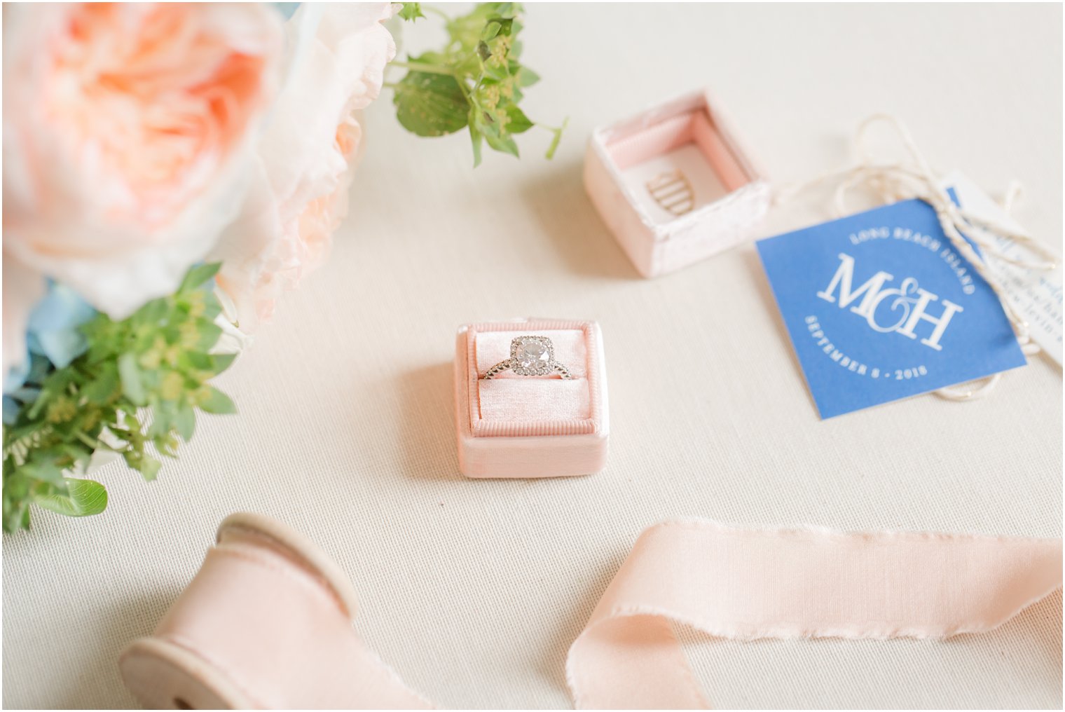 diamond ring in peach ring box photographed by LBI wedding photographer Idalia Photography