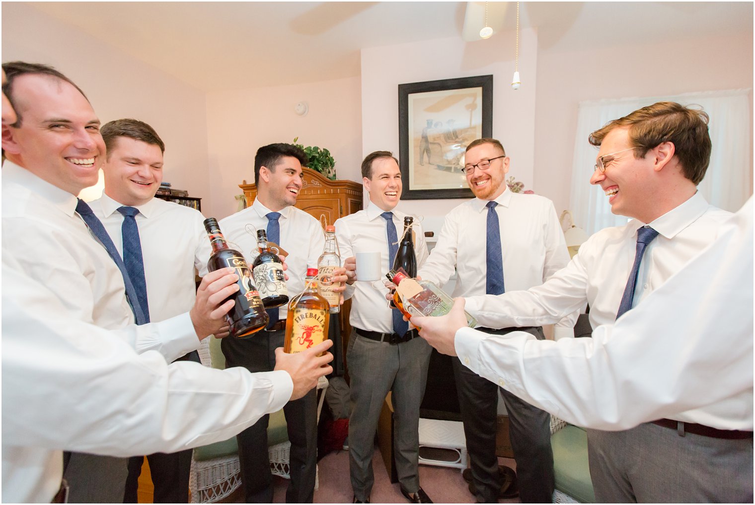 groom and groomsmen cheer LBI wedding day by Idalia Photography