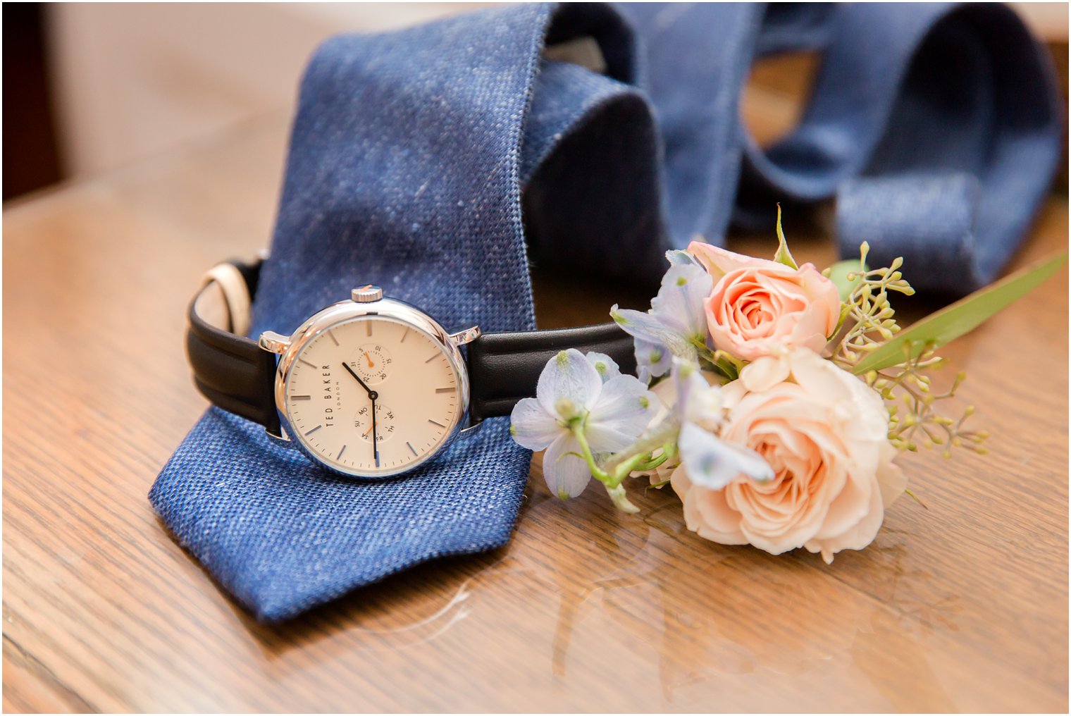 groom's watch on navy tie before LBI wedding day photographed by Idalia Photography