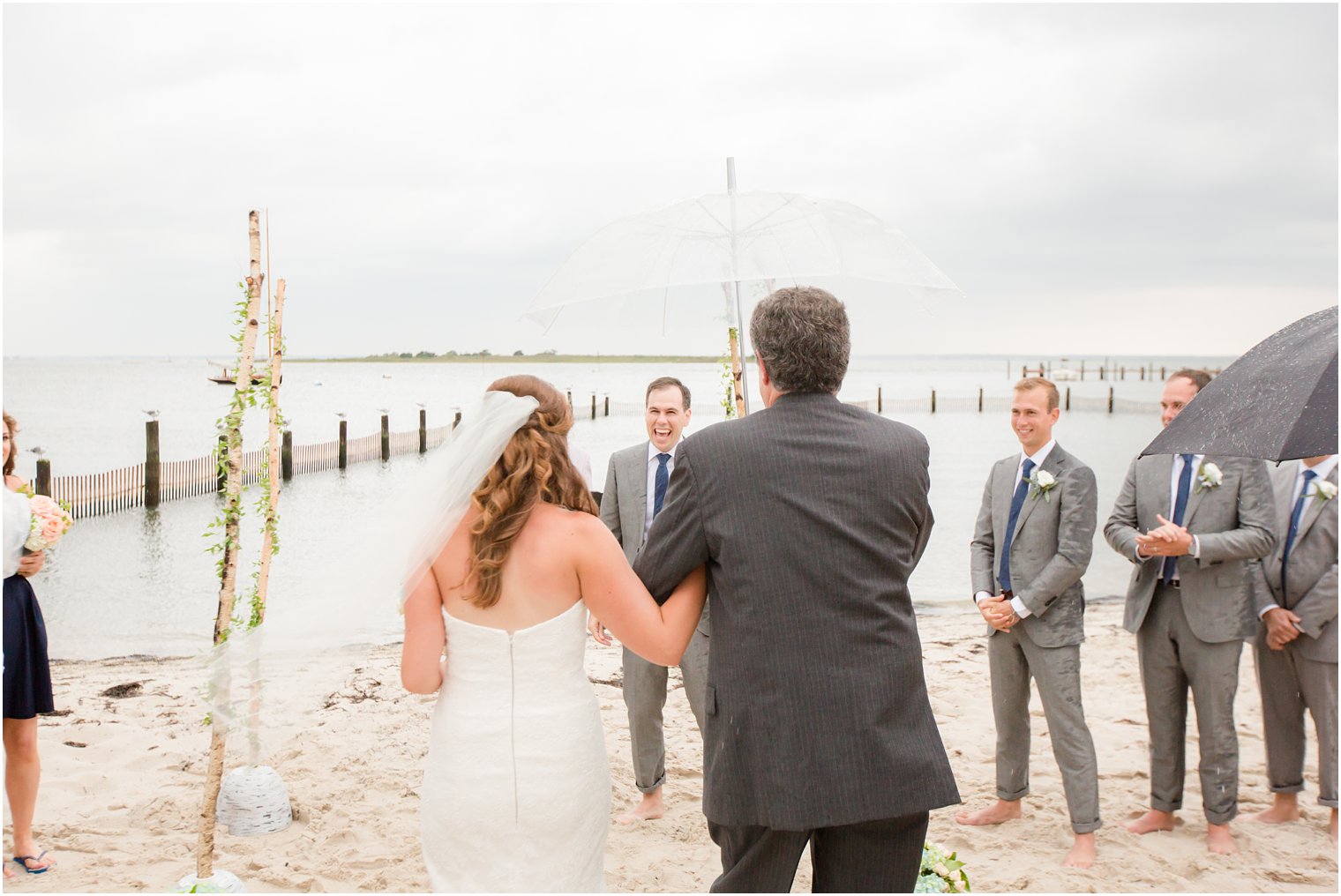 groom sees bride down aisle during Brant Beach Yacht Club wedding
