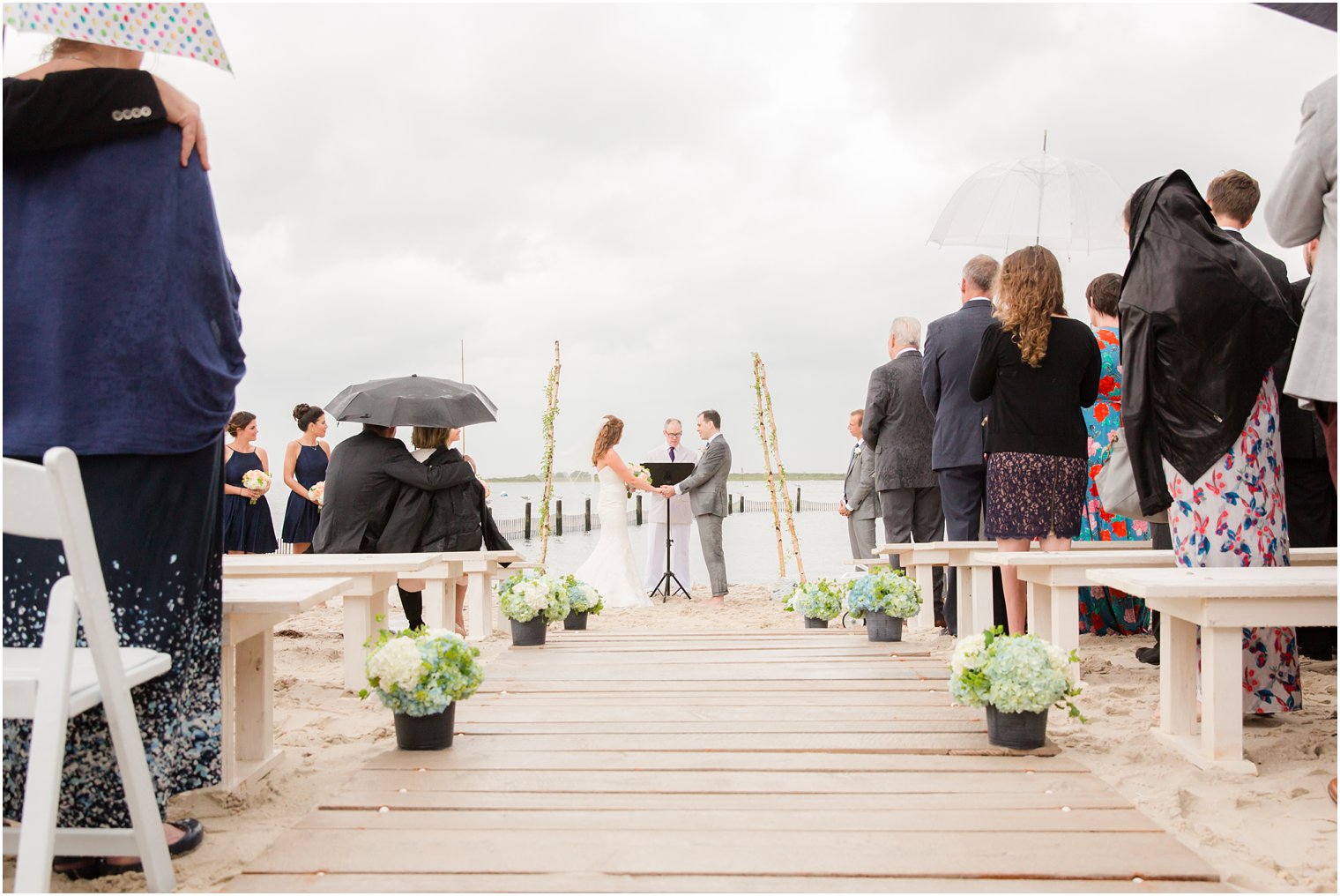 oceanfront beach wedding photographed by Brant Beach Yacht Club wedding photographer Idalia Photography
