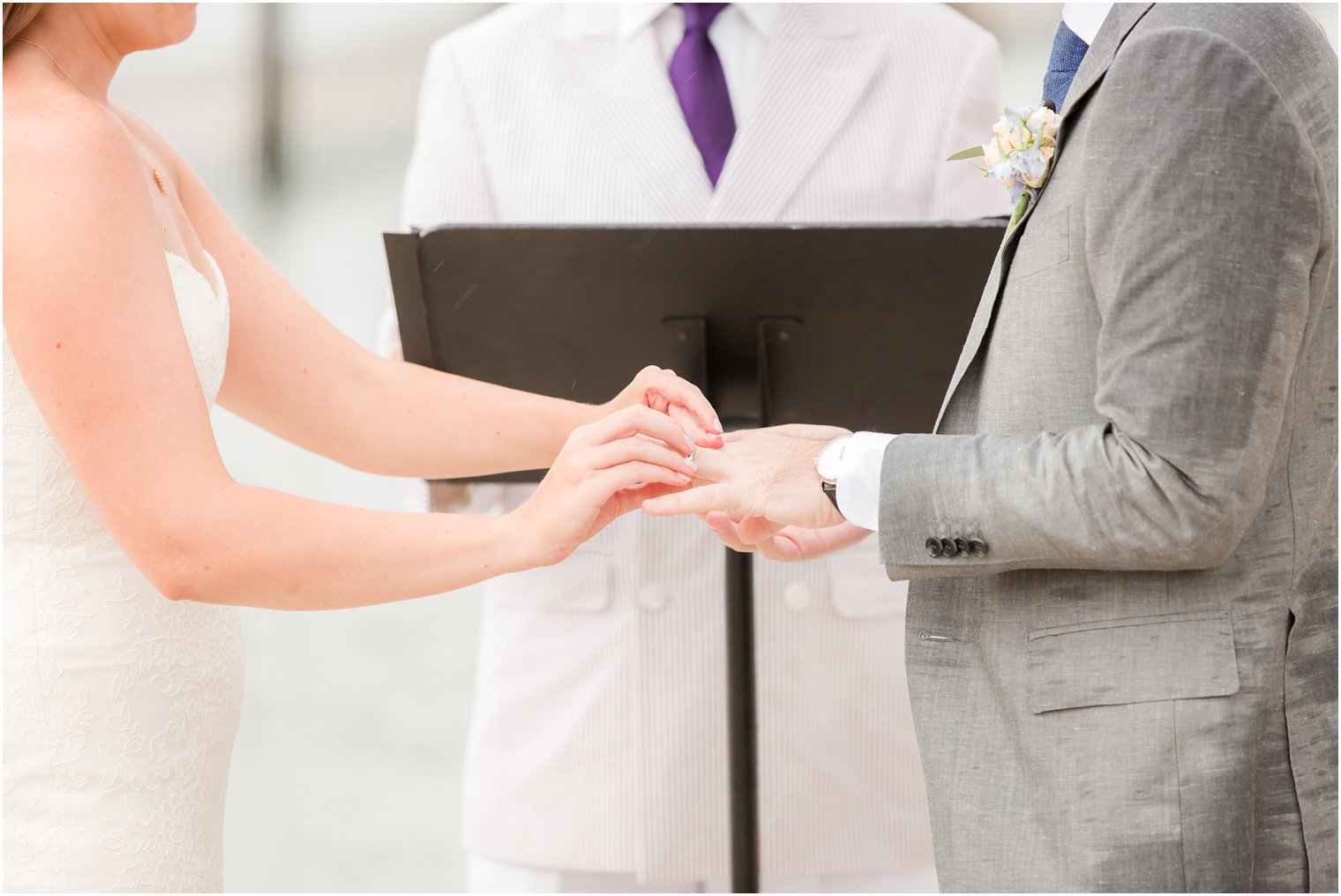 ring exchange on Brant Beach Yacht Club photographed by NJ wedding photographer Idalia Photography