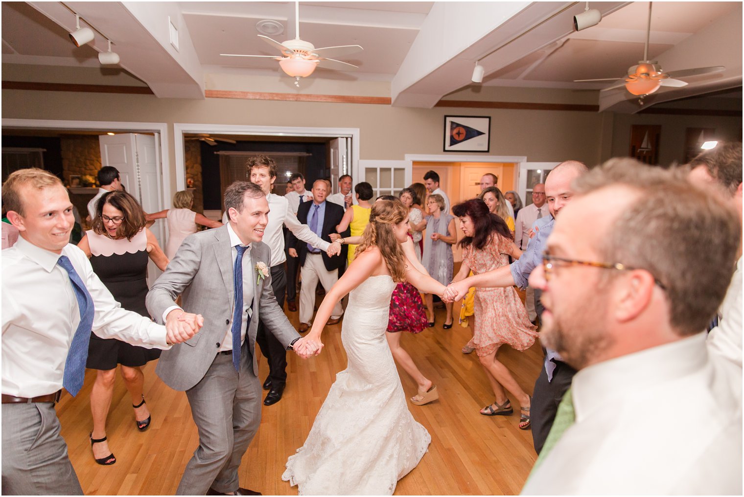 bride and groom dance during party at Brant Beach Yacht Club photographed by Idalia Photography