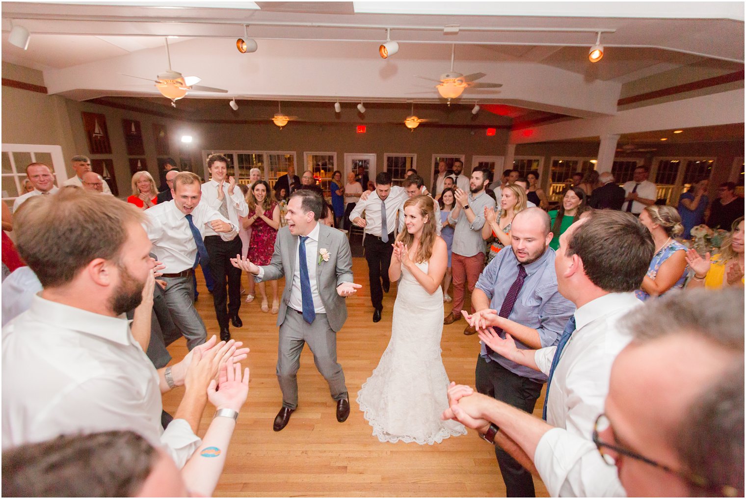 dancing at wedding reception at Brant Beach Yacht Club photographed by Idalia Photography
