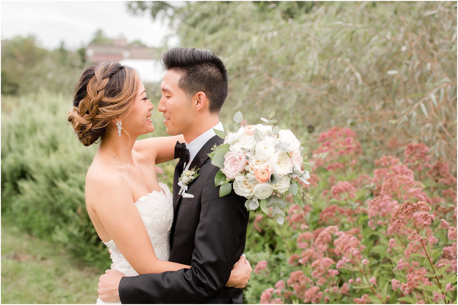 Idalia Photography photographs wedding day at Chauncey Hotel while bride holds pastel bouquet by Peonia