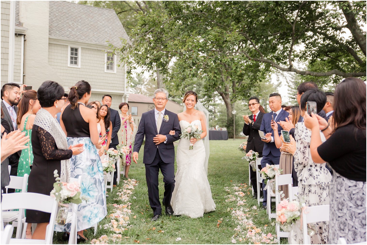 bride and father walk down aisle at Chauncey Hotel for wedding day 