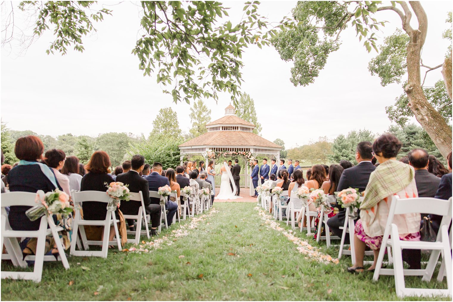 outdoor garden wedding ceremony at Chauncey Hotel photographed by NJ wedding photographer Idalia Photography