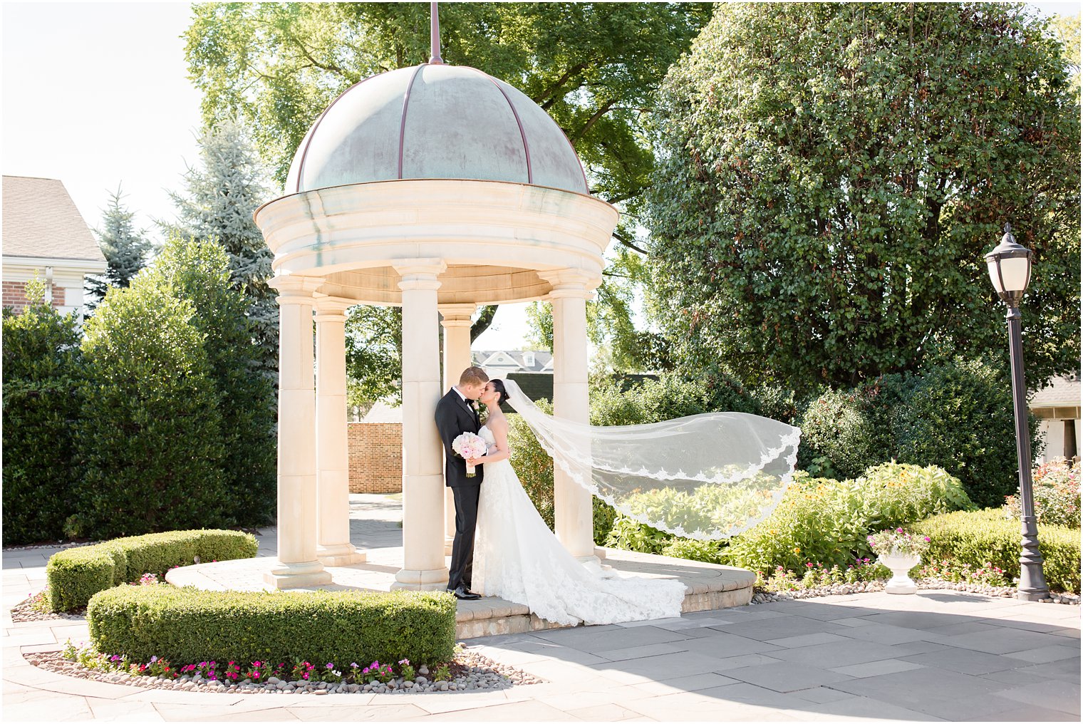 romantic floating veil photo of bride and groom