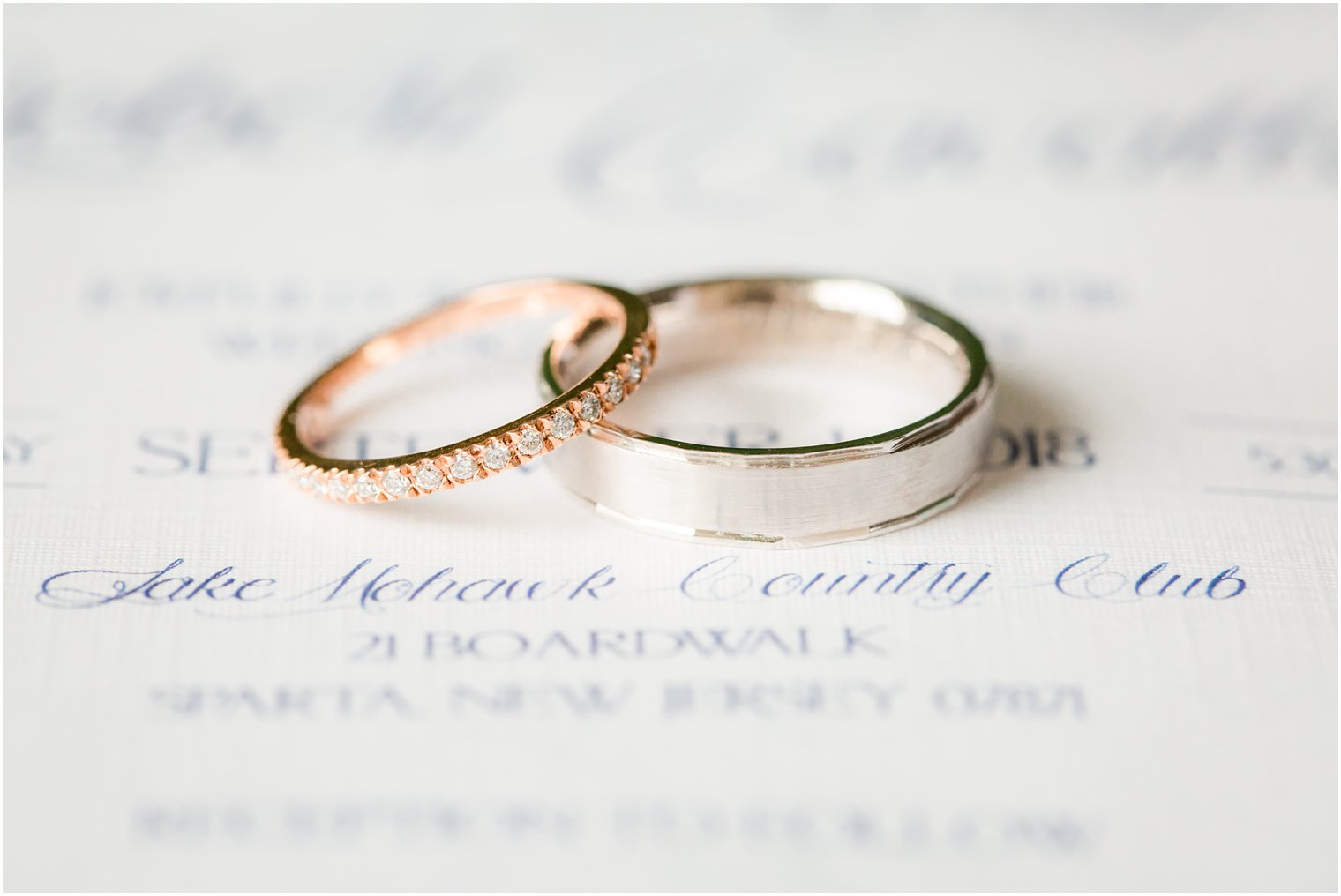 rose gold and silver wedding bands on wedding invitation by JLB Papery