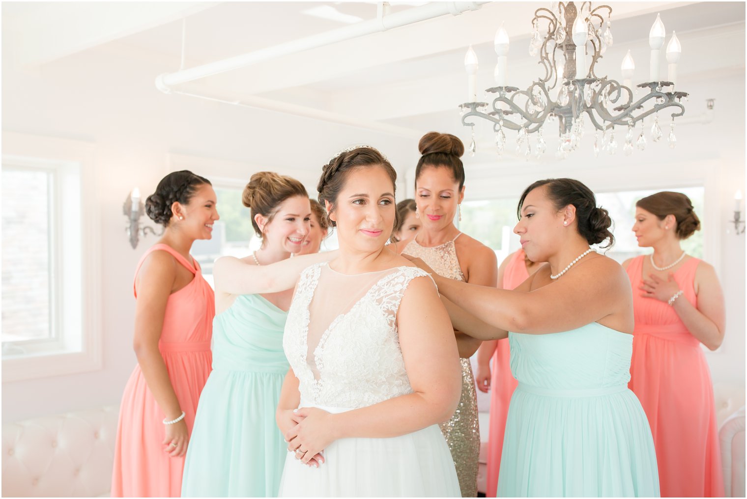 bridesmaids help bride into Watters wedding dress before Lake Mohawk Country Club wedding day