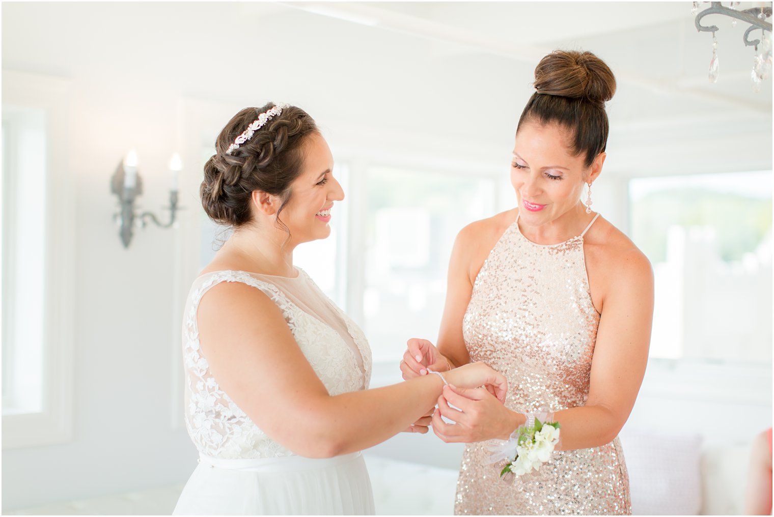 mom helps bride with bracelet by Idalia Photography