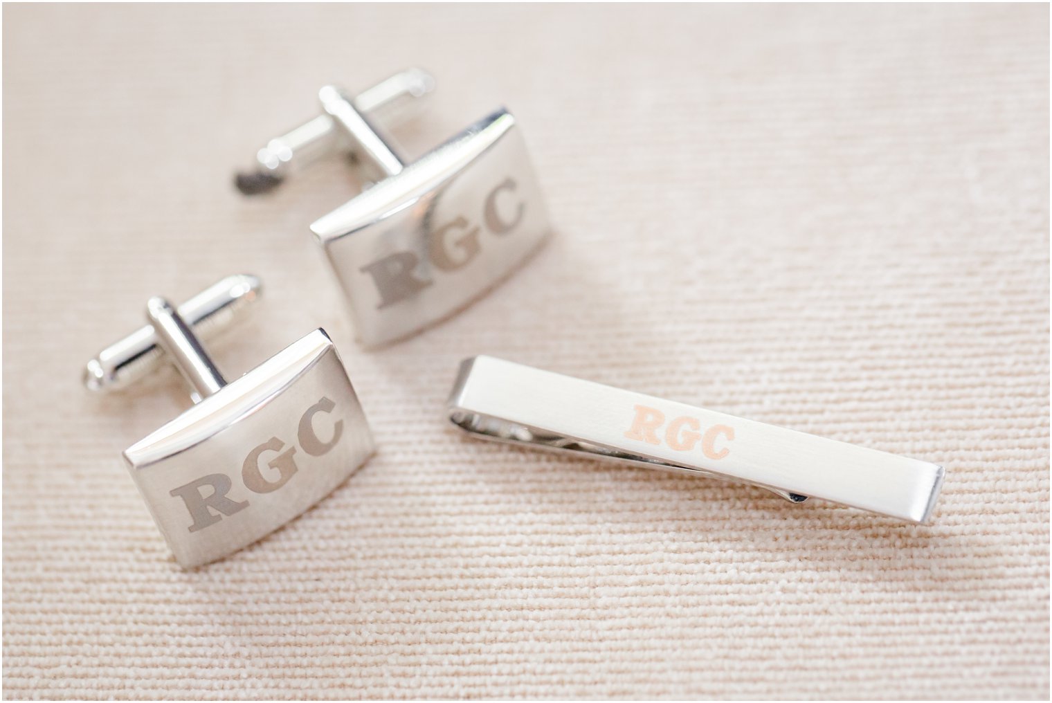 cuff links and tie clip for groom photographed by Idalia Photography