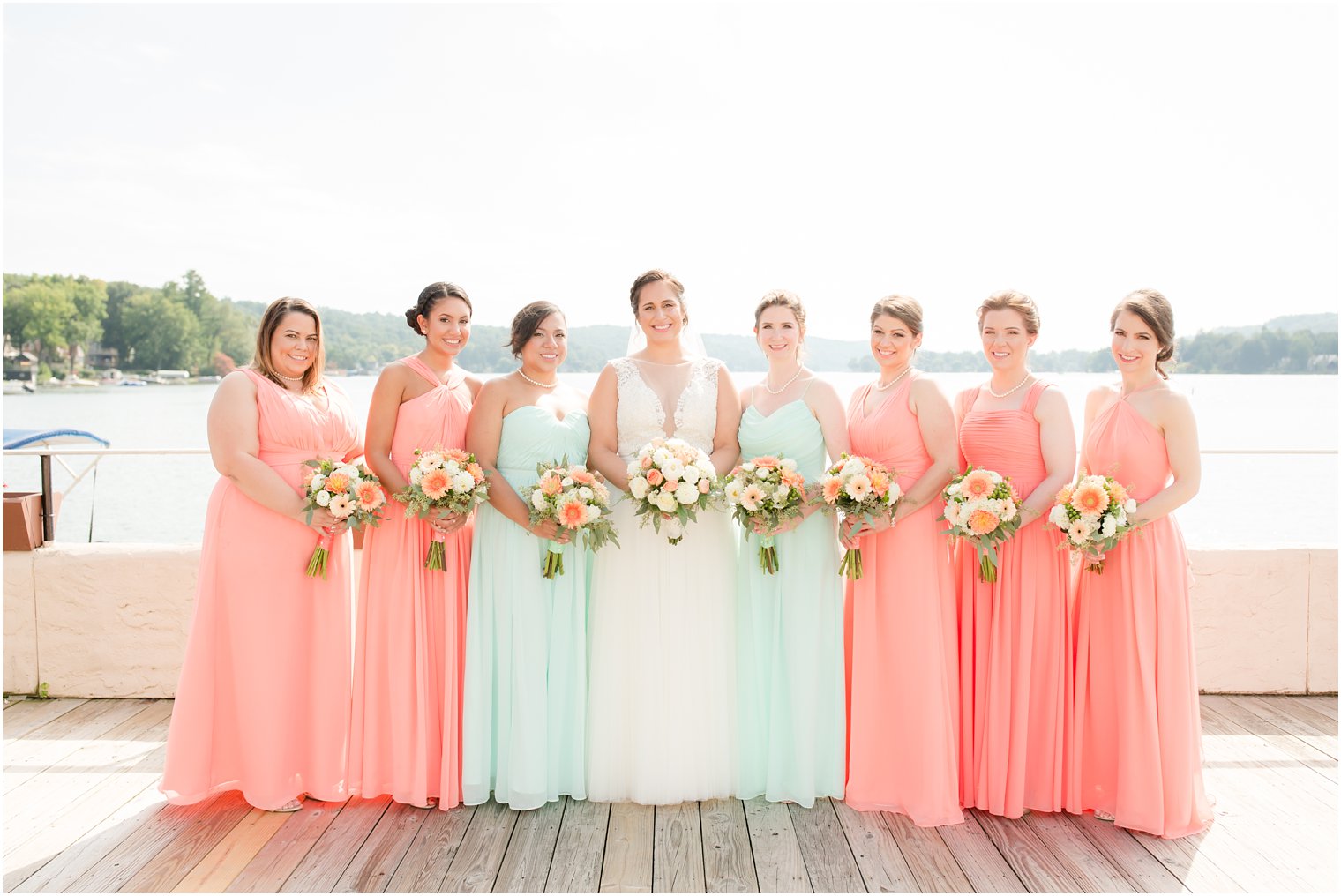 coral and ivory wedding bouquets for bridal party by Entenmann's Florist by Idalia Photography